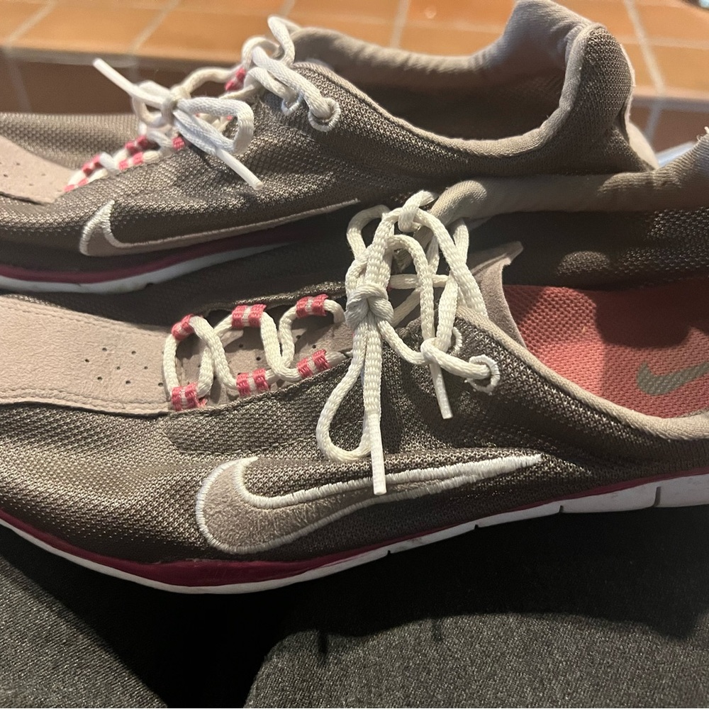 Super lt wt Nikes. Taupe w pink. Packs flat, cute for casual. Very light wear.